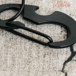 Porte-clé en inox avec fonction décapsuleur