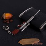 Porte-clé en métal avec effet d'arme