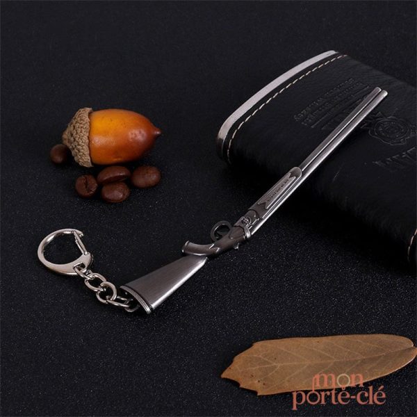 Porte-clé stylisé inspiré d'une arme