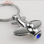 Porte-clé en forme d'avion stylisé