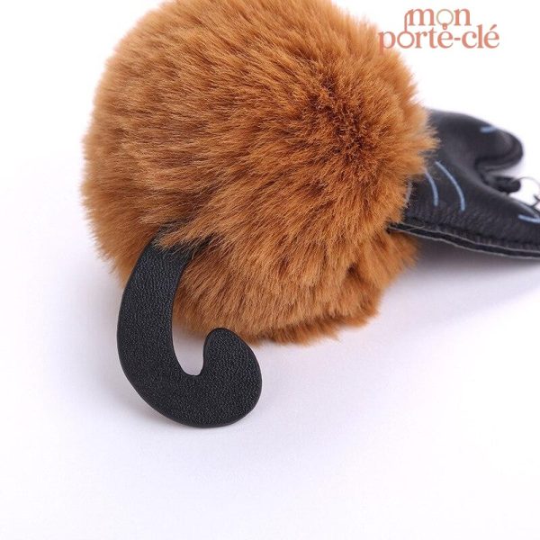 Porte-clé ludique avec pompon et chat