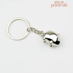 Porte-clé en métal représentant un cochon sympathique