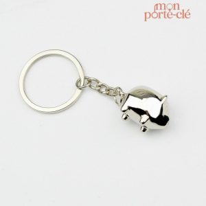 Porte-clé en métal représentant un cochon sympathique