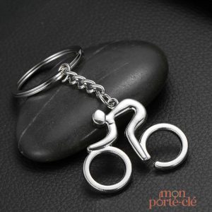 Porte-clé stylisé représentant un cycliste en action