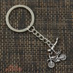 Porte-clé FMX avec motif Superman pour passionnés de moto