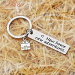 Porte-clé New Home, symbole d'un nouveau départ et d'une nouvelle aventure