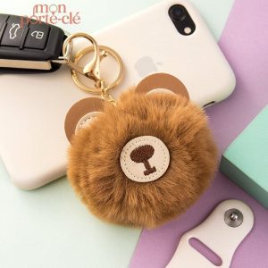 Porte-clé original avec pompon et motif ours adorable