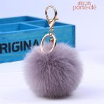 Porte-clé pompon gris élégant et tendance