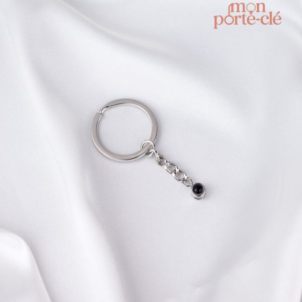 Porte-clé avec image projetée en lumière