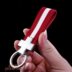 Accessoire masculin : porte-clé en acier, lanière rouge