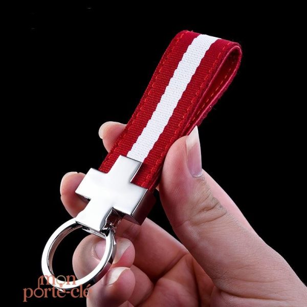 Accessoire masculin : porte-clé en acier, lanière rouge