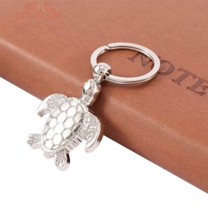 Porte-clé décoratif tortue avec finition argent